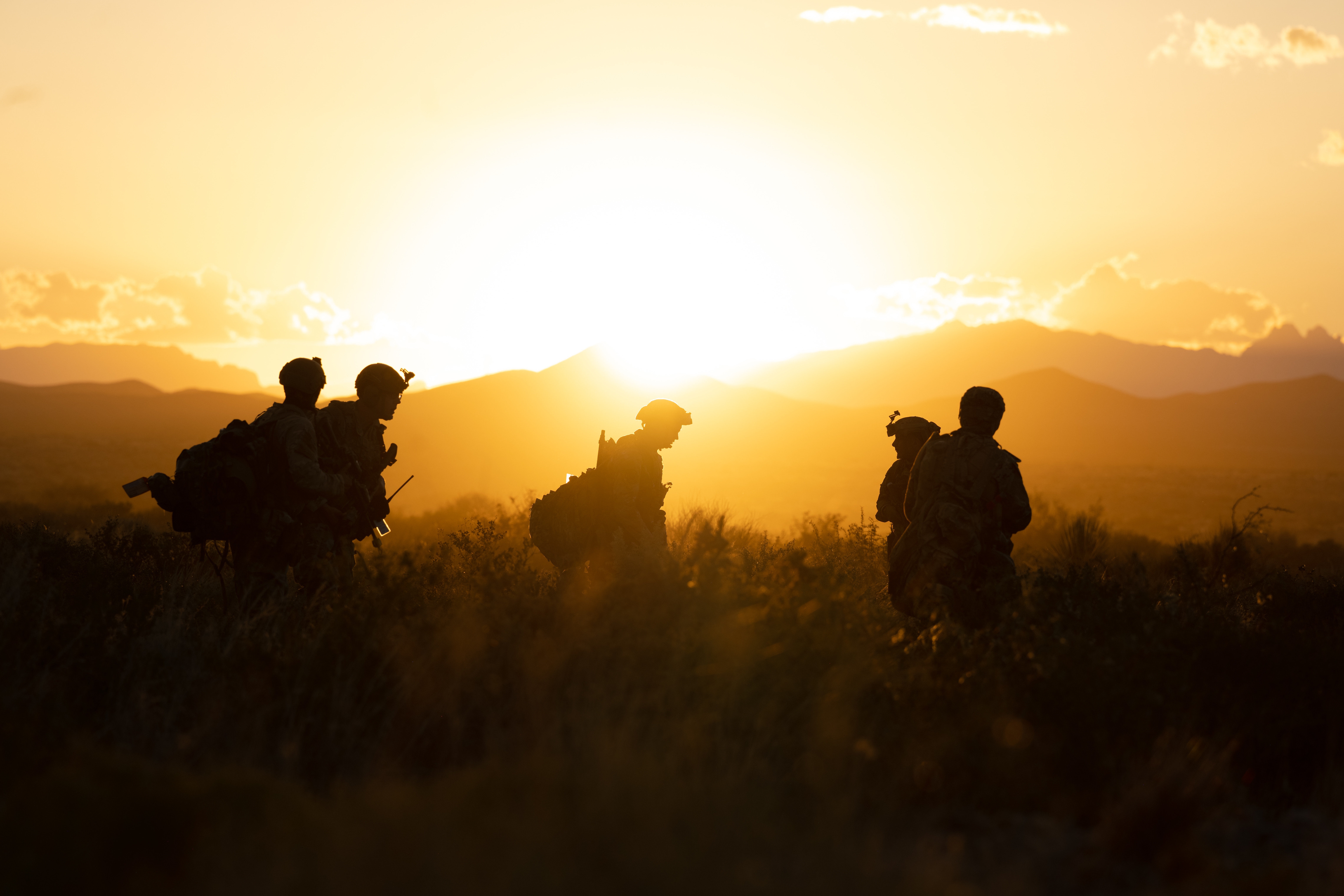 Airmen walking across field